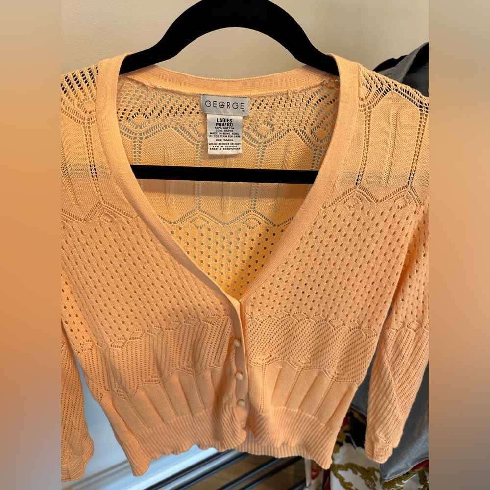 Oh so lovely peach colored cardigan. The buttons, oh the buttons!!! So so pretty